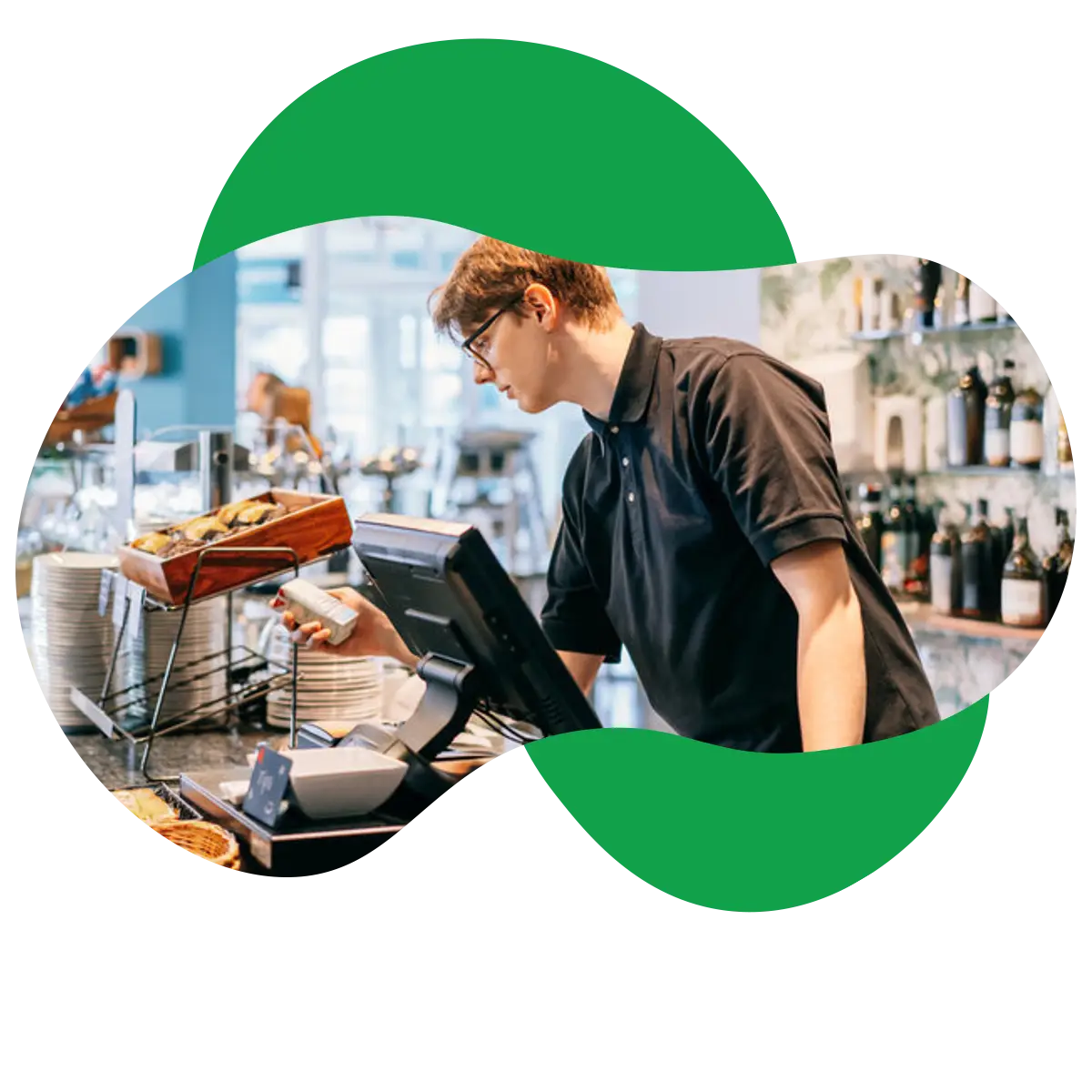 Young man working in a coffee shop